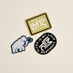 Three Lake Missoula Tea Company stickers: Mammoth, Drink Tea Read Books, and Tea Is My Love Language