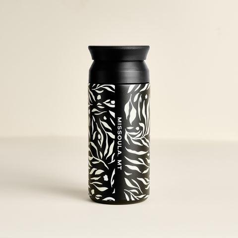 Black 12 oz tumbler with botanical leaf print and Missoula, MT