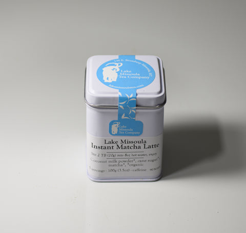 Cropped image of Lake Missoula Tea Company's Instant Matcha tea powder in a bowl with a whisk, ready for preparing a matcha latte.