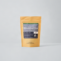 Lake Missoula Breakfast Tea Winter Collection. Tan bag on blue background with blue label.