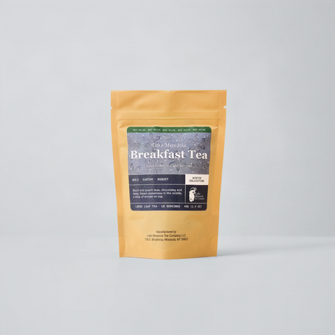Lake Missoula Breakfast Tea Winter Collection. Tan bag on blue background with blue label.