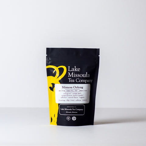 Close-up of Lake Missoula Tea Company's Mimosa Oolong tea leaves in a 40g package, showcasing the dry tea leaves.