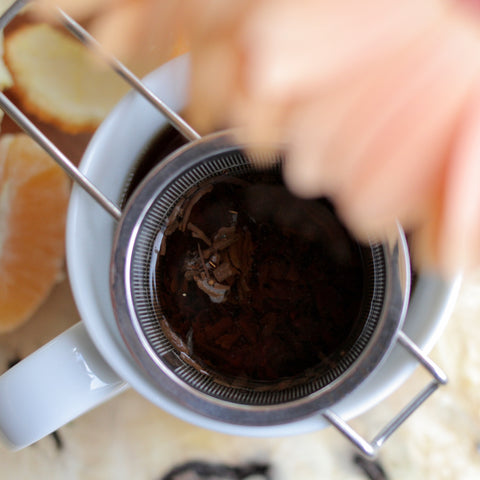 Loose herbal tea blend called Skin Glow from Lake Missoula Tea Company, featuring dried herbs and botanicals in a clear jar