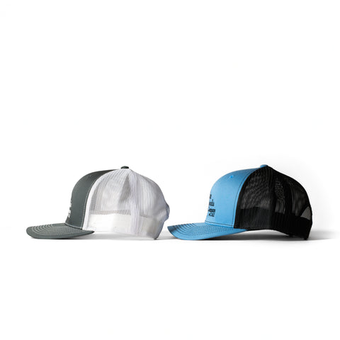Lake Missoula Tea Company trucker hat with mesh back and embroidered front panel, casual outdoor headwear.