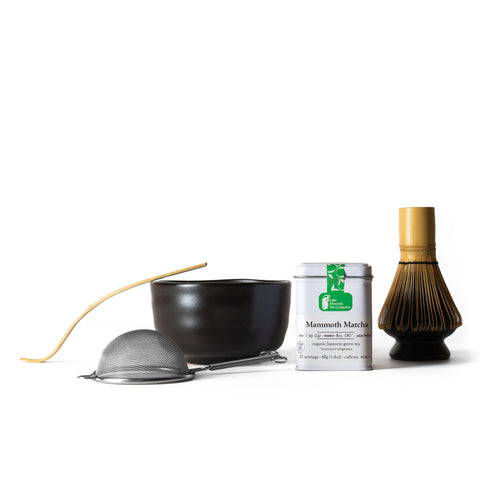 Black matcha tea set with bowl, whisk, and scoop from Lake Missoula Tea Company, perfect for preparing matcha tea.
