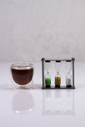 Lake Missoula Tea Company sand tea timer for perfect brewing, featuring a clear glass body with colorful sand for timing tea steeping.