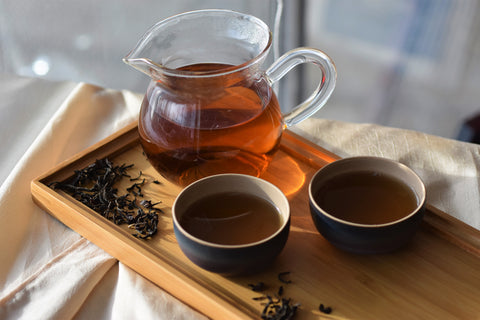 Sangamon Sunset Red tea leaves displayed on a tray, showcasing vibrant red tea from Lake Missoula Tea Company.