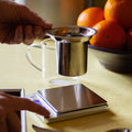 Square image of Lake Missoula Tea Company's creamy vanilla orange tea in a clear cup, showcasing the vibrant tea color and aroma.