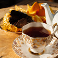 Square-shaped holiday chocolate orange flavored tea from Lake Missoula Tea Company, featuring vibrant packaging.