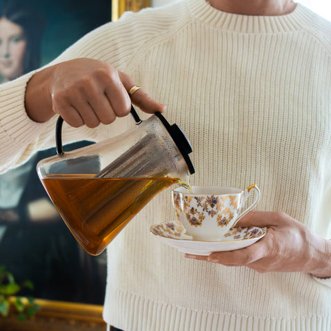 Square image of Lake Missoula Tea Company's Vanilla Crème tea in a teacup with a tea bag, showcasing its rich, creamy vanilla flavor.