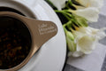 Early spring Royal Lapsang tea from Lake Missoula Tea Company, featuring dry tea leaves with smoky aroma and rich amber brew.