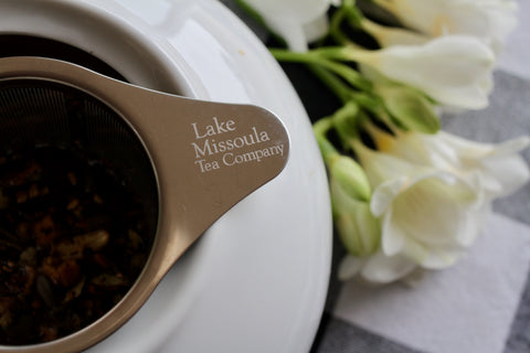 Early spring Royal Lapsang tea from Lake Missoula Tea Company, featuring dry tea leaves with smoky aroma and rich amber brew.