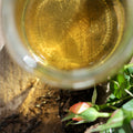Fresh spearmint tea from Lake Missoula Tea Company in a clear glass cup, showcasing vibrant green mint leaves and brewed tea.