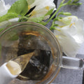 Lake Missoula Tea Company's Willy Wonka Chocolate Cardamom tea in a brewed cup, showcasing rich chocolate and fragrant cardamom flavors.