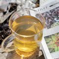 Fresh nettle tea from Lake Missoula Tea Company, showing dried nettle leaves in a rustic tea packaging.
