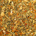 Close-up of Maureen's Cure Singer's Tea by Lake Missoula Tea Company, showing the textured tea blend in a rustic container.
