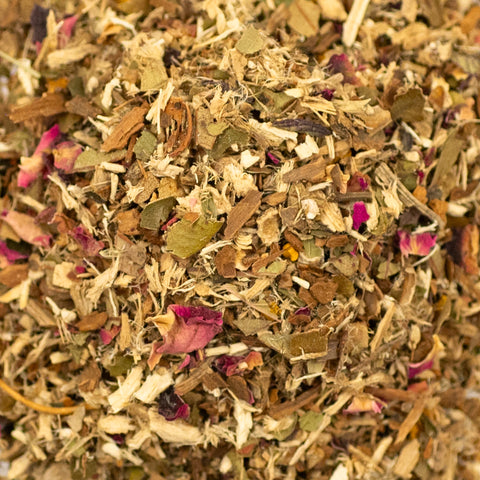 Close-up of Lake Missoula Tea Company's Sweet Rhapsody tea with vibrant, textured leaves and floral accents in the image.