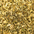 Close-up of Lake Missoula Tea Company Uplift tea with textured dry leaves and vibrant herbal ingredients.