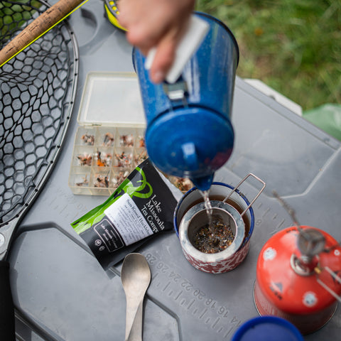 Sun-Kissed Huckleberry tea by Lake Missoula Tea Company, showcasing a vibrant tea blend with fresh huckleberries and herbal ingredients.