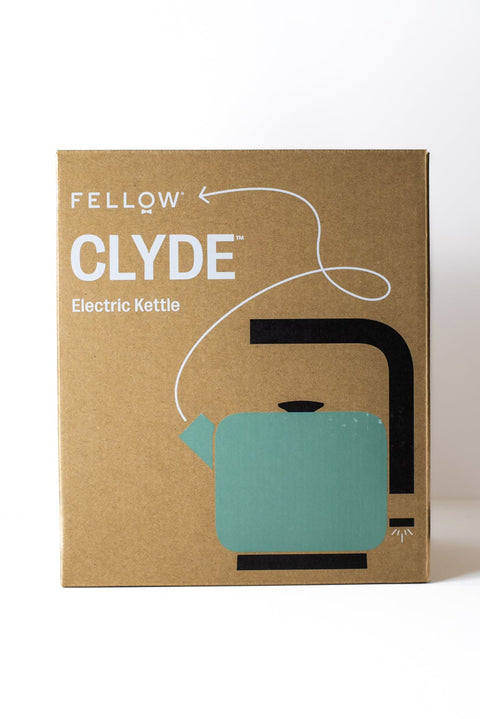 Cardboard packaging of a 'Fellow Clyde Electric Kettle' on a white background