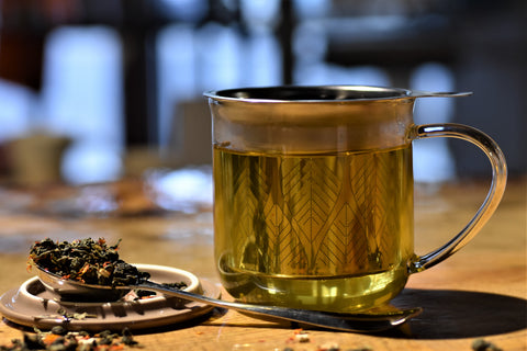 Close-up of Lake Missoula Tea Company's Mimosa Oolong tea leaves showing vibrant colors and detailed leaf texture.