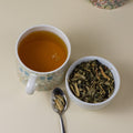 Close-up of Who Chic tea packaging from Lake Missoula Tea Company, featuring a sleek design and botanical illustrations.