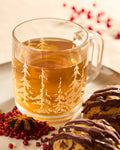 Lake Missoula Tea Company Harvest Moon Pumpkin Spice Chai brewed in glass mug with pumpkin cookies and herbs