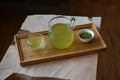Yuzu Matcha Kuki Cha tea leaves on a tray, showcasing the green tea from Lake Missoula Tea Company.