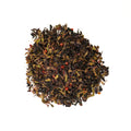 A cup of Rift Valley Currant tea by Lake Missoula Tea Company, showcasing a brewed tea with a rich, reddish hue in a white teacup.