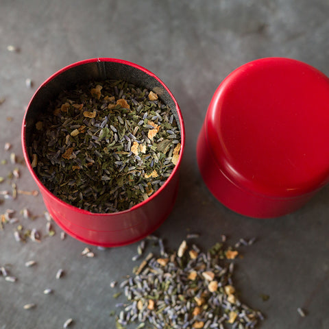 Close-up of Lake Missoula Tea Company's "A Few of My Favorite Things" tea can in red, showcasing the product packaging.
