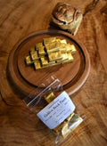 Golden Brick Puerh tea from Lake Missoula Tea Company, featuring a pressed golden tea brick with a toad design.