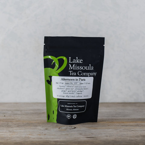 Bag of Lake Missoula Tea Company's Afternoon in Paris herbal tea, 2oz, featuring a colorful, aromatic blend in a clear bag.