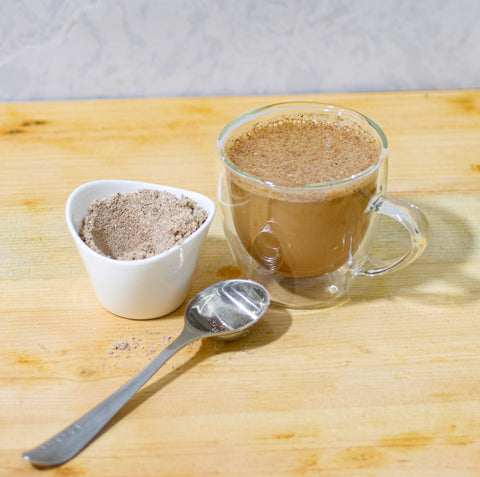 A steaming cup of Lake Missoula Tea Company's INSTANT Chai tea in a white mug, showing the rich, spicy tea inside.