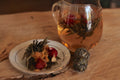 Flowering Tea Double Happiness from Lake Missoula Tea Company, beautifully blooming tea ball in a clear glass cup.