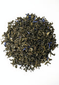 Loose leaf Blueberry Green tea from Lake Missoula Tea Company, featuring vibrant blue and green tea leaves with blueberry bits.