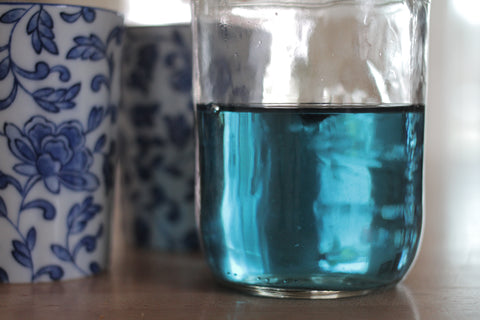 Jar of Butterfly Pea Flower tea by Lake Missoula Tea Company, featuring vibrant blue dried flowers in a clear glass jar.