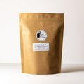 Dried butterfly pea flowers in a clear container, used for making herbal tea, from Lake Missoula Tea Company.