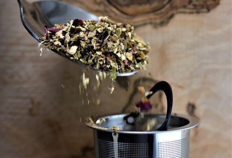 Sweet Rhapsody tea from Lake Missoula Tea Company, featuring a colorful blend of dried herbs and flowers in a clear jar.