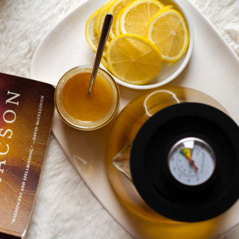 Lake Missoula Tea Company's Zen Cleanse tea with lemon slices in a clear glass pitcher, showcasing fresh ingredients and vibrant colors.