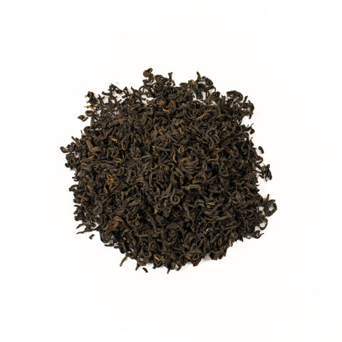 Panda Ruby Red tea by Lake Missoula Tea Company featuring a vibrant red herbal blend in a clear glass cup.