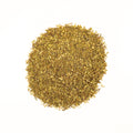 Green Rooibos tea from Lake Missoula Tea Company, showing vibrant green leaves in a close-up shot.