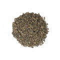 Loose Gunpowder Pearls green tea from Lake Missoula Tea Company, featuring tightly rolled green tea leaves in pearl form.