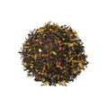 Cup of Cinnamon Orange Spice tea from Lake Missoula Tea Company with cinnamon sticks and orange slices on a wooden table.