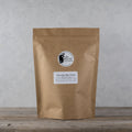 Loose Chocolate Mint Puerh tea leaves from Lake Missoula Tea Company in a 500g package, showcasing dark tea leaves with chocolate and mint aroma.