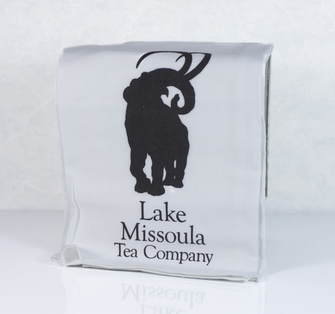 Lake Missoula Tea Company Animal Conservation Tea Bundle with a tea towel featuring animal conservation-themed artwork.