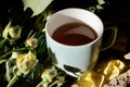 Dried black tea flowers in a wooden cup, from Lake Missoula Tea Company, showcasing the decaf black tea blend.