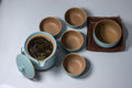 Golden Eyebrows Jin Jun Mei tea leaves from Lake Missoula Tea Company displayed in a light blue minimalist setting.