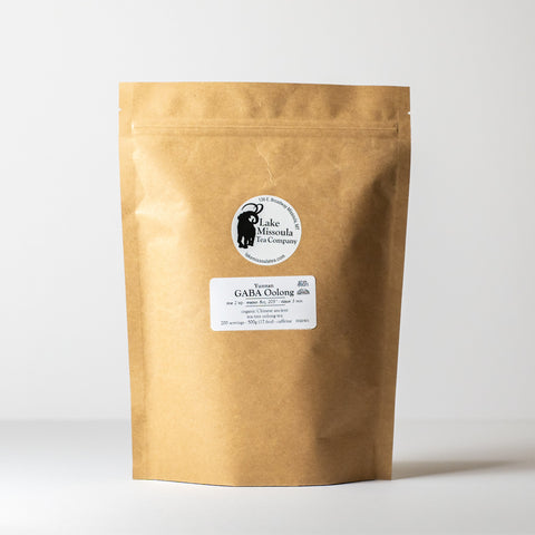 Loose GABA Oolong tea leaves from Lake Missoula Tea Company in a clear glass jar.