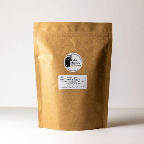Bulk 500g Jasmine Puerh tea from Lake Missoula Tea Company showing dried jasmine-infused puerh tea leaves.