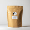 Medium Java Oolong tea leaves from Lake Missoula Tea Company in a 500g package, showcasing the rolled, dark tea leaves.
